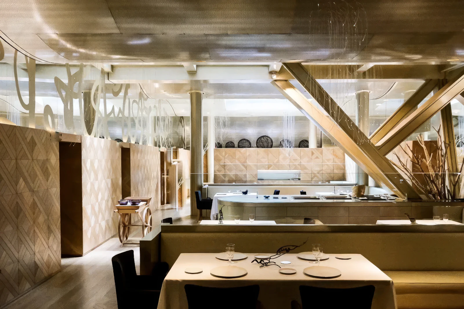 Elegant restaurant interior with set dining table and wood-panelled décor in neutral tones.